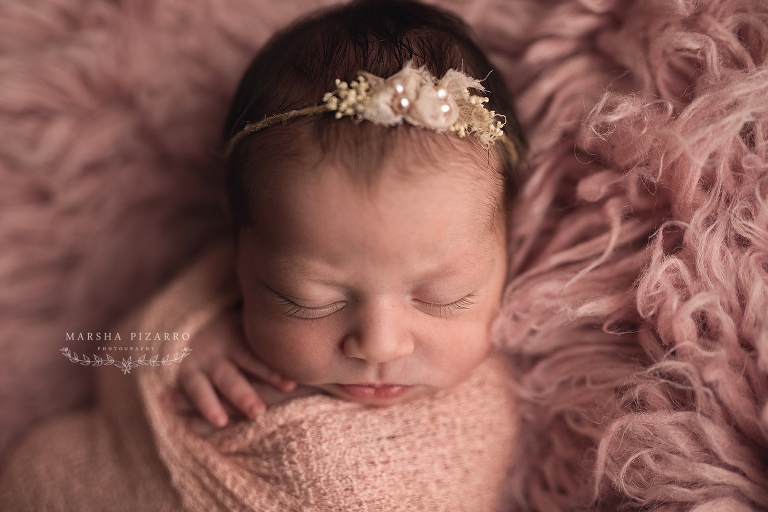 newborn photographer captures baby wearing pearls