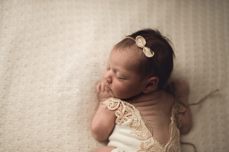newborn in lace romper
