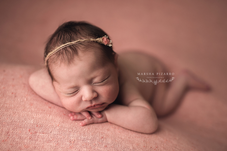 newborn on pink background