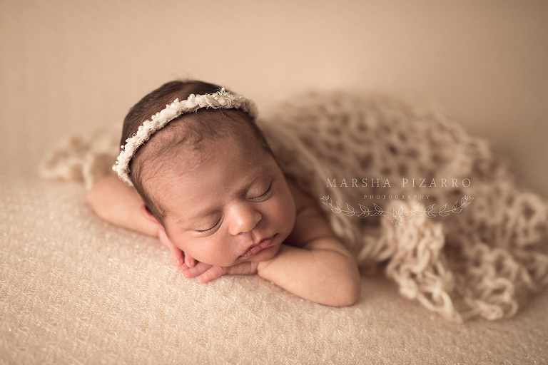 newborn pose with blanket