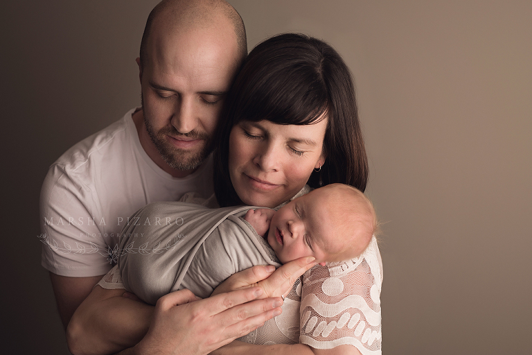 newborn baby with mom and dad