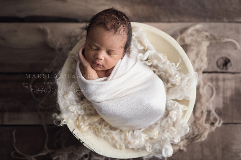 Newborn in white bowl