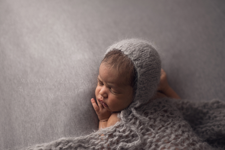Calgary newborn with blanket and bonnet