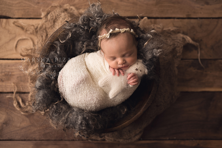 baby in wooden basket