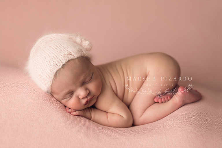 newborn baby wearing knit hat