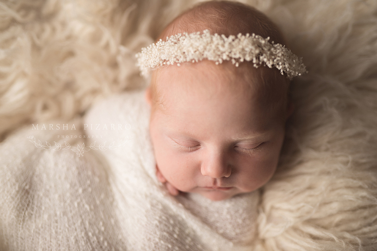 baby with white headband
