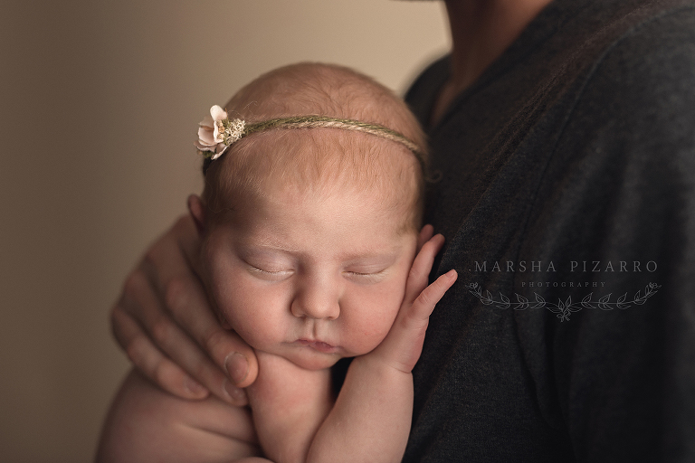 baby held during studio newborn session
