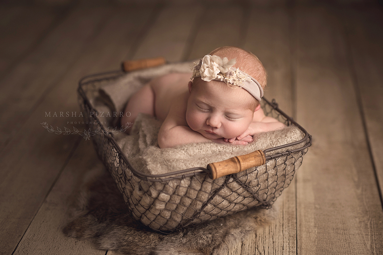 baby girl sleeps in basket