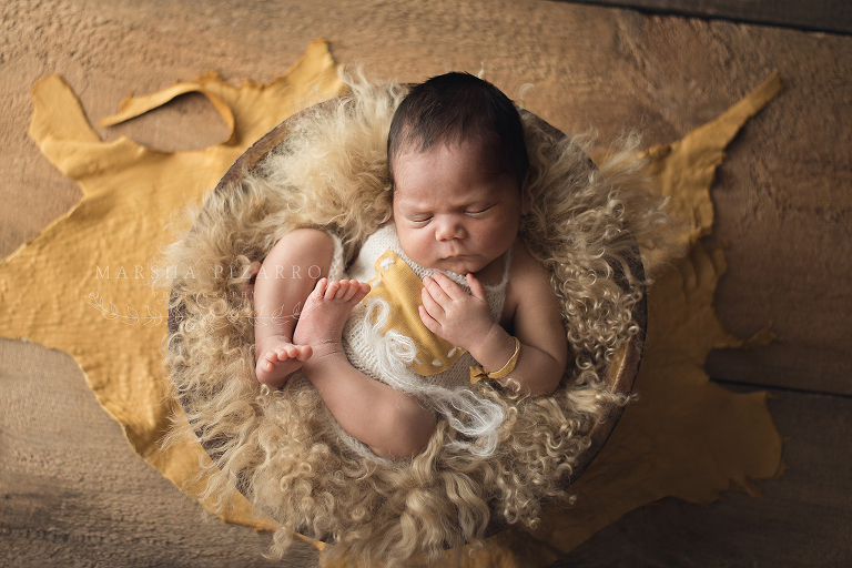 newborn wrapped in fur 